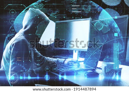 Cyber security concept with faceless hacker silhouette working with laptop and computer and abstract digital screen with glowing world map. Double exposure.