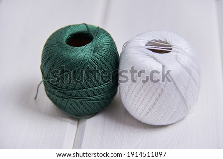 skeins of yarn of different colors on a white background. Knitting lessons for beginners. High quality photo