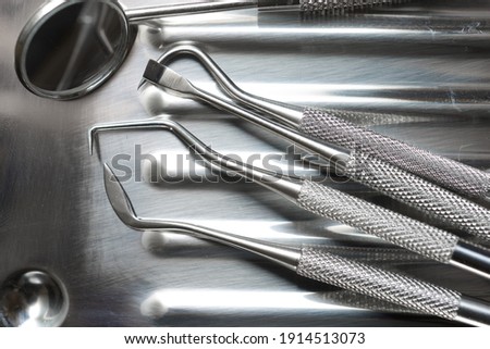 Instruments used by the dentist on a metal tray. Royalty-Free Stock Photo #1914513073