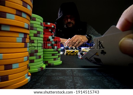 High stakes Texas hold 'em poker game at the casino Royalty-Free Stock Photo #1914515743
