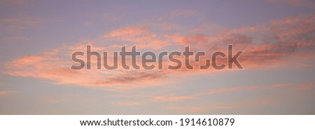 Clouds at sunset. Atmospheric pink sky. Abstract natural background, beautiful in nature.