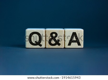 Concept word 'Q and A' on cubes on a beautiful grey background. Business concept, copy space. Royalty-Free Stock Photo #1914615943