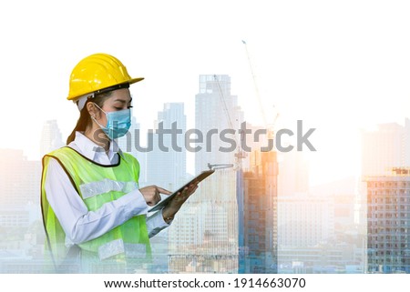 Double exposure worker look project document thinking about building project and control investment money this work with construction building background. she wearing face mask to protect pollution.