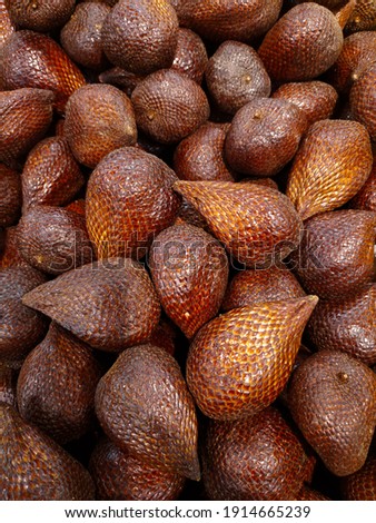 Salaks fruit is grown in southeast Asia. It has a spiky look and has a leathery rap and a nut shaped inside. You can eat it with a little sugar or salt or even make it into a helpful eye cream.Delicio