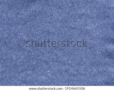 Grunge textured blue recycled retro paper with natural fiber parts