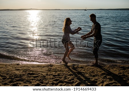 romantic couple in love relaxing on the seashore