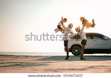 Family vacation holiday,Happy family, parents holding children flying in the sky.Concept family and Holiday and travel. Royalty-Free Stock Photo #1914671437