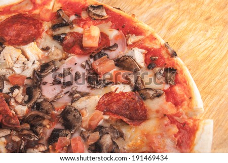 Pizza on cutting board on table
