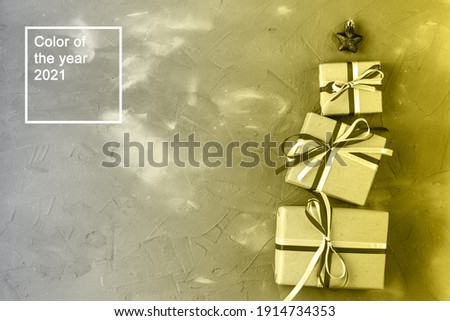 gift boxes in the shape of a Christmas tree with a red star. Christmas celebration concept. Color of the year 2021
