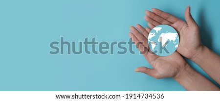 Hands holding earth, save planet, earth day, sustainable living, ecology environment, climate emergency action, world environment day concept Royalty-Free Stock Photo #1914734536