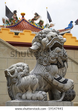 Chinese lion on the background of oriental architecture