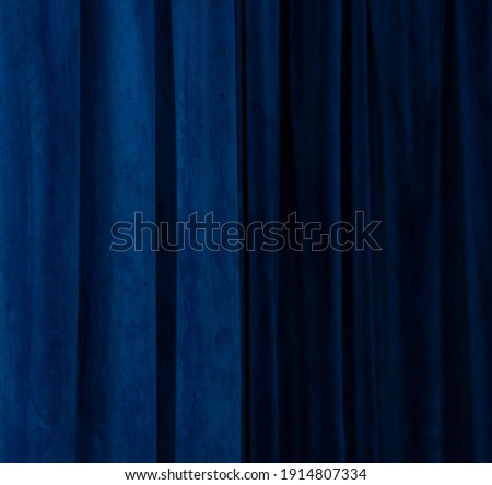 
Blue fabric background. Curtain abstraction