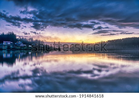 Magic colorful sunrise at a lake 