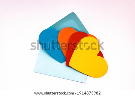 colorful heart-shaped papers for bisexual love messages or for gay chat sites concept photo on colorful envelopes. copy space for your text. 
