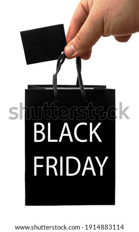 Blank black bag mock up holding in hand. Empty paper package mockup hold in hands isolated. Consumer pack ready for logo design or identity presentation. Product packet handle. black friday