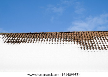 Snow on a house roof