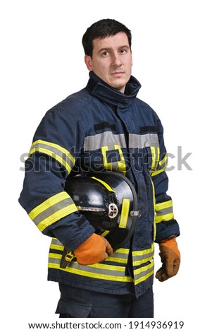 Young brave man in uniform of firefighter holds hardhat and looking to camera isolated on white background