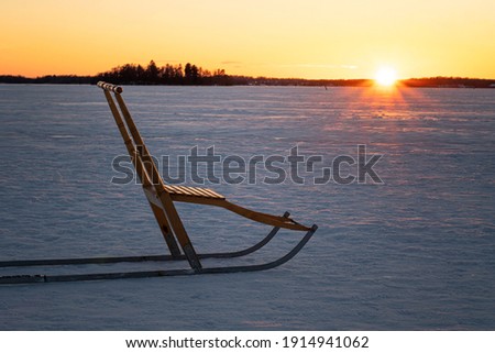 Snow kick, also known as kick sled, in a winter landscape during sunset. Photo taken in Vasteras, Sweden.