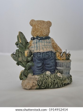 Ceramic statue antique teddy bear doubling up as piggy bank
