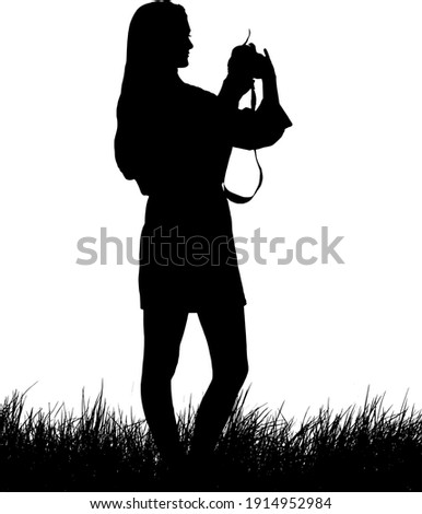 Silhouette of a woman photographer