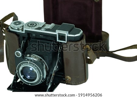 Old photo camera with paper bellows in zoom - large format