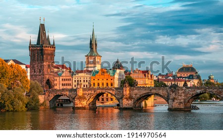 Prague - colorful sunset view on old town, Charles bridge and Vltava river, Czech Republic   Royalty-Free Stock Photo #1914970564