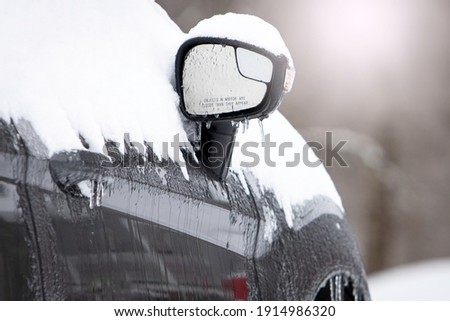 Grey car in snow and ice Royalty-Free Stock Photo #1914986320