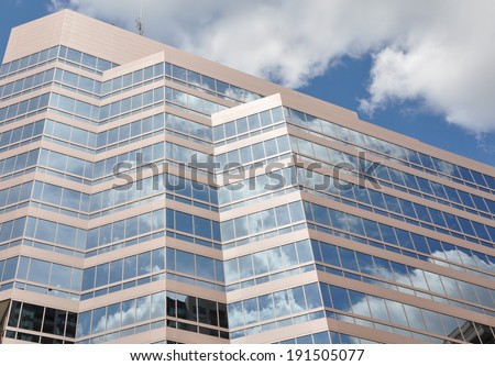 Clouds reflection in glass building