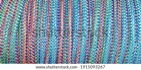 Colored knitted cord for construction and repair.