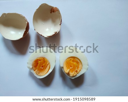 Peeled hard boiled eggs on the ground