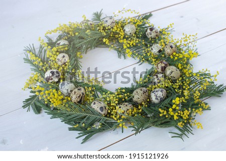 Spring Mimosa Wreath With Quail Eggs. Easter Card Concept. Image With Soft Focus And Bokeh