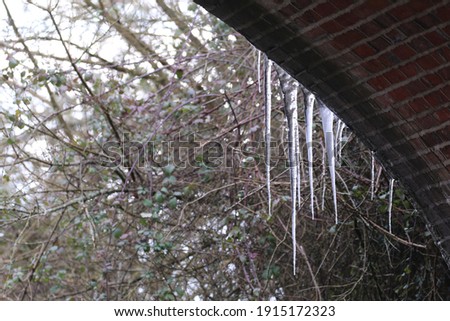 Icicles hanging off a bridge