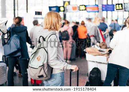 Unrecognizable people, a view from the back, a queue at the airport for check-in. Royalty-Free Stock Photo #1915178404