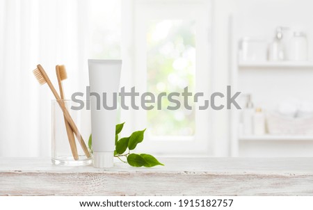 Eco bamboo toothbrushes and toothpaste tube mockup with copy space Royalty-Free Stock Photo #1915182757
