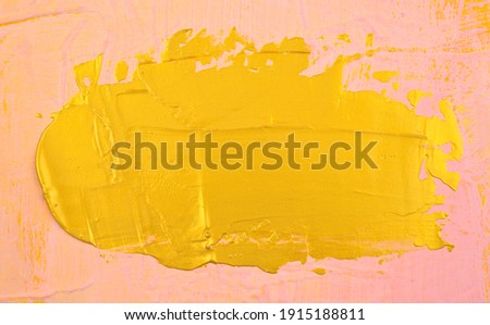 Gold element acrylic coating, painting plate-form like on pink matte canvas abstract texture background. Handmade, hand drawn. Center composition. Horizontal picture.