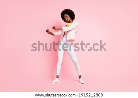Full length body size view of lovely skinny cheerful girl listening melody enjoying dancing rest chill isolated over pink color background