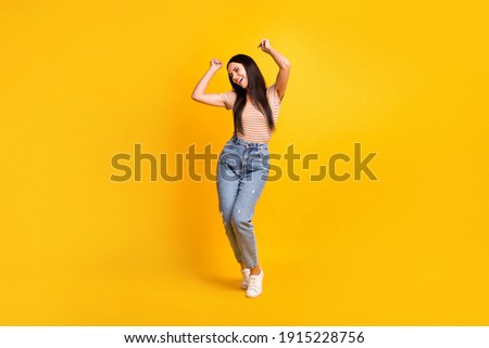 Full length body size photo of female student chilling at party dancing on floor singing song isolated on vivid yellow color background