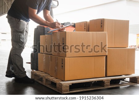 Workers Holding Clipboard is Checking Stock of Package Boxes. Storage Warehouse. Inventory Management Supplies. Supply Chain. Shipment Goods Shipping Warehouse Logistics. Royalty-Free Stock Photo #1915236304