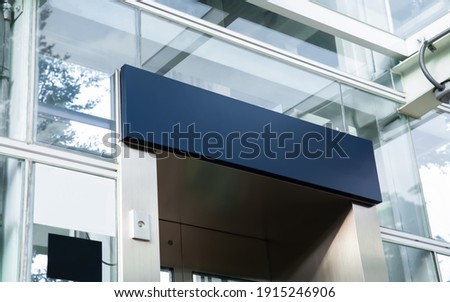 blank blue sign on an outdoor elevator in the city street, put your texts or sign symbols