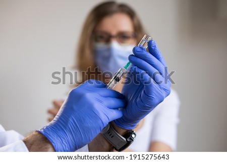 woman in risk group getting coronavirus vaccine
