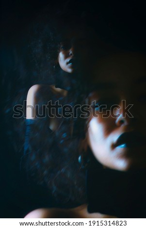 African girl photo studio black background double exposure