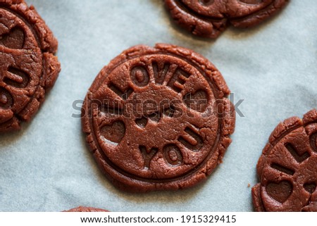 Food pattern. Raw chocolate cookies with sign I love you. Top view. Flat lay. Valentines day celebration concept