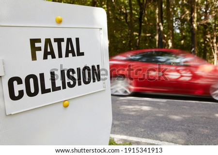 Fatal Collision Sign Next To Scene Of Accident On Busy Road