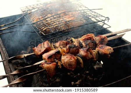 Image of pork and chicken skewers, grilled on skewers and grills, winter 2021.