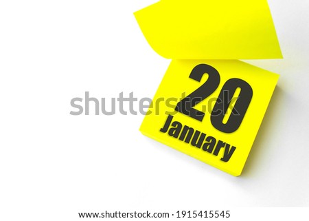 January 20th. Day 20 of month, Calendar date. Close-Up Blank Yellow paper reminder sticky note on White Background. Winter month, day of the year concept