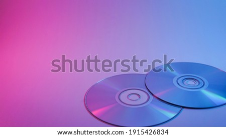 CD-ROM . red and blue illumination, cyberpunk photo Royalty-Free Stock Photo #1915426834