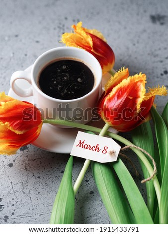 white cup of coffee, tulips on the table, good morning on March 8, International Women's Day