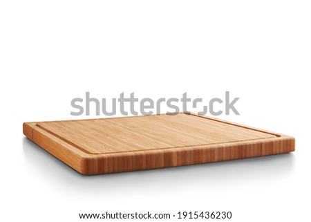 new rectangular wooden cutting board, in top of wooden table with a minimalistic limbo background Royalty-Free Stock Photo #1915436230