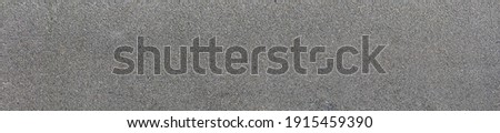 Background and texture of the road surface is made of asphalt and small stones. Royalty-Free Stock Photo #1915459390