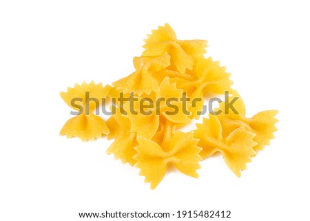 A variety of types and shapes of Italian pasta. Dry pasta bows farfalle. Heap of bow tie macaroni isolated on white background. Butterfly pasta.  Royalty-Free Stock Photo #1915482412